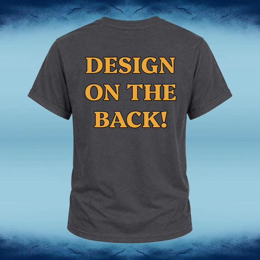 A dark gray t-shirt shown from the back, featuring the text 'DESIGN ON THE BACK!' printed in a bold yellow font with a black outline. The t-shirt is centered against a blue gradient background with a textured, cracked pattern at the top and bottom.