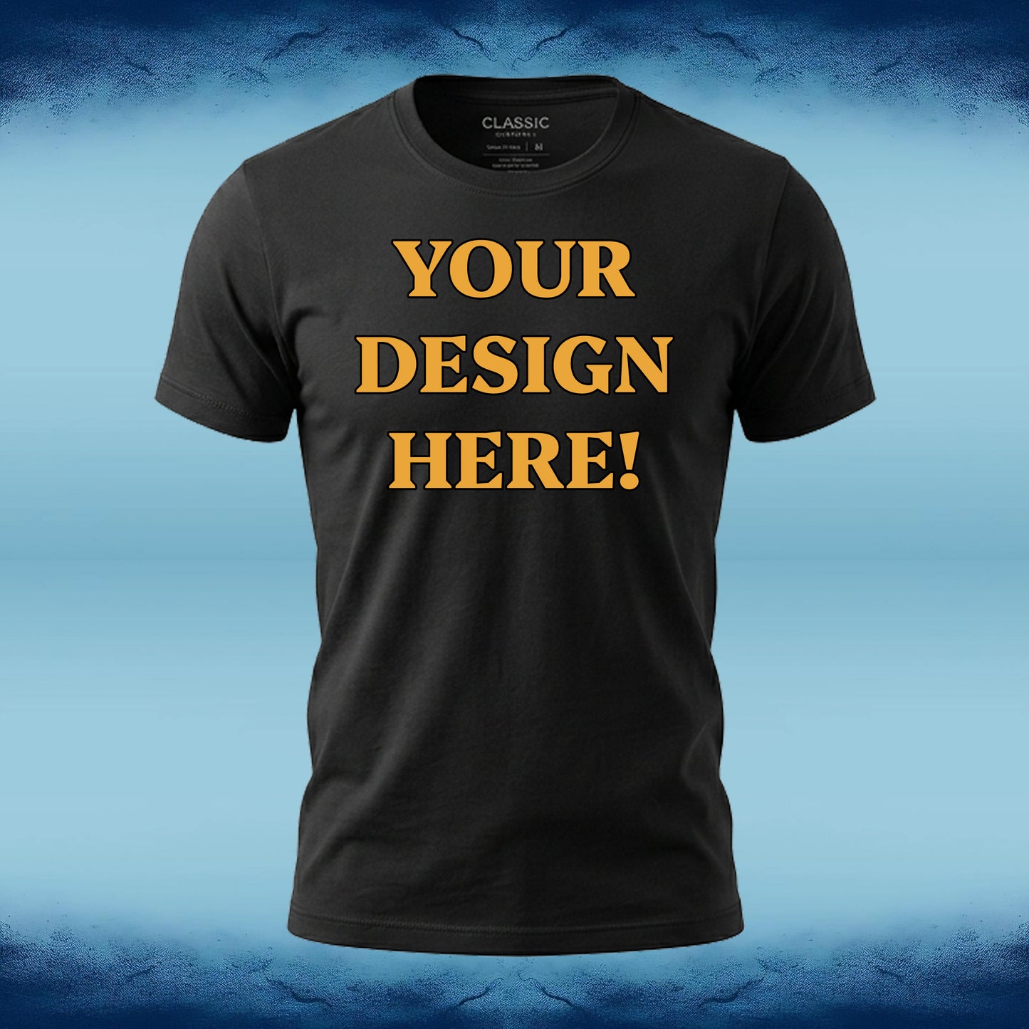 A black short-sleeve t-shirt with the words 'YOUR DESIGN HERE!' printed in bold yellow capital letters on the front, displayed against a blue gradient background.