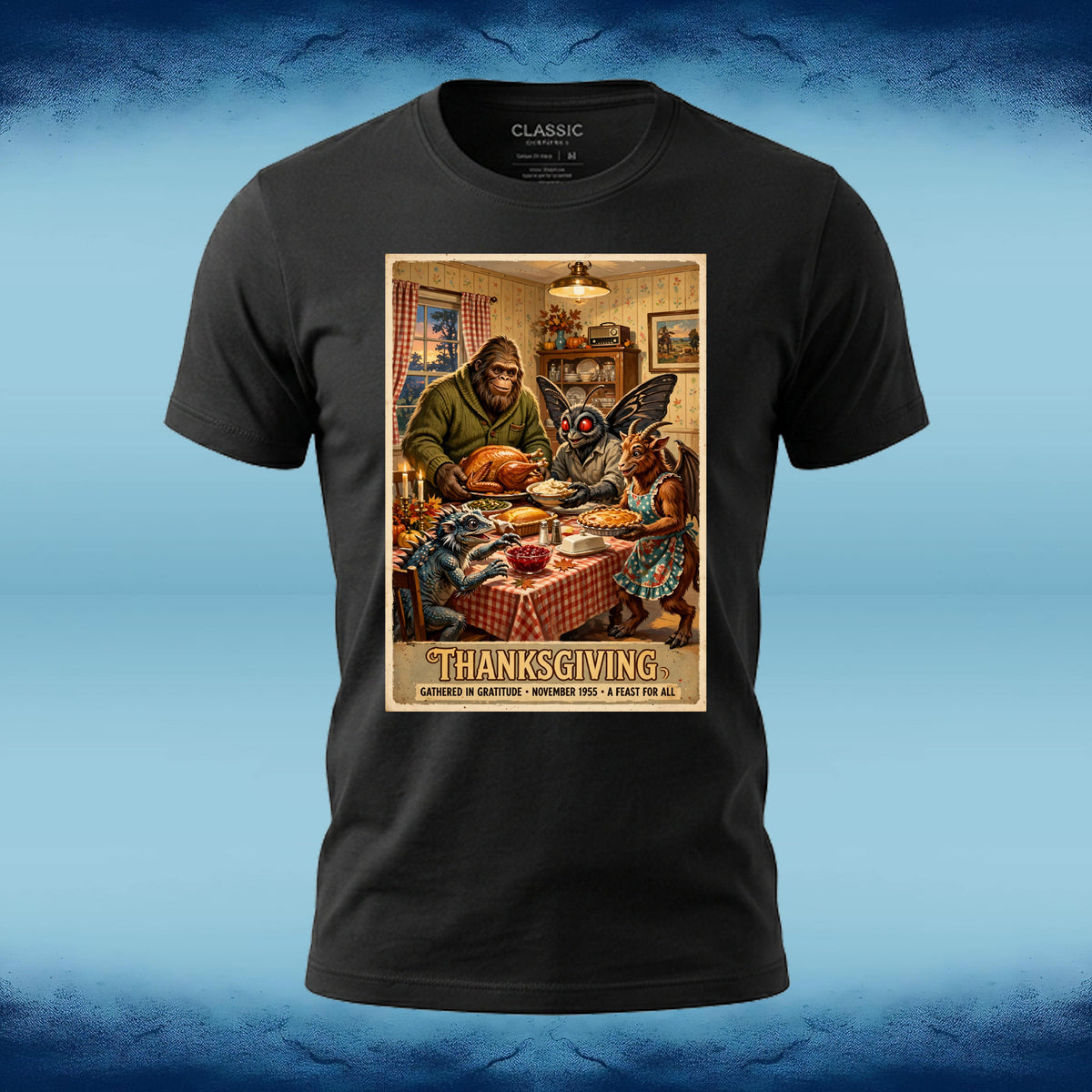 Black crewneck graphic tee featuring Bigfoot, Mothman, and fellow cryptids gathered around a Thanksgiving dinner table.