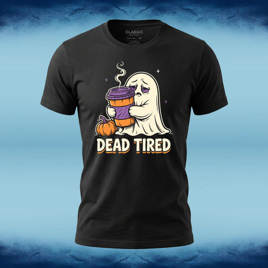 A black short-sleeve graphic t-shirt featuring a cartoon ghost holding a purple coffee cup next to a pumpkin with the text 'DEAD TIRED' underneath. The shirt is displayed on a blue textured background.