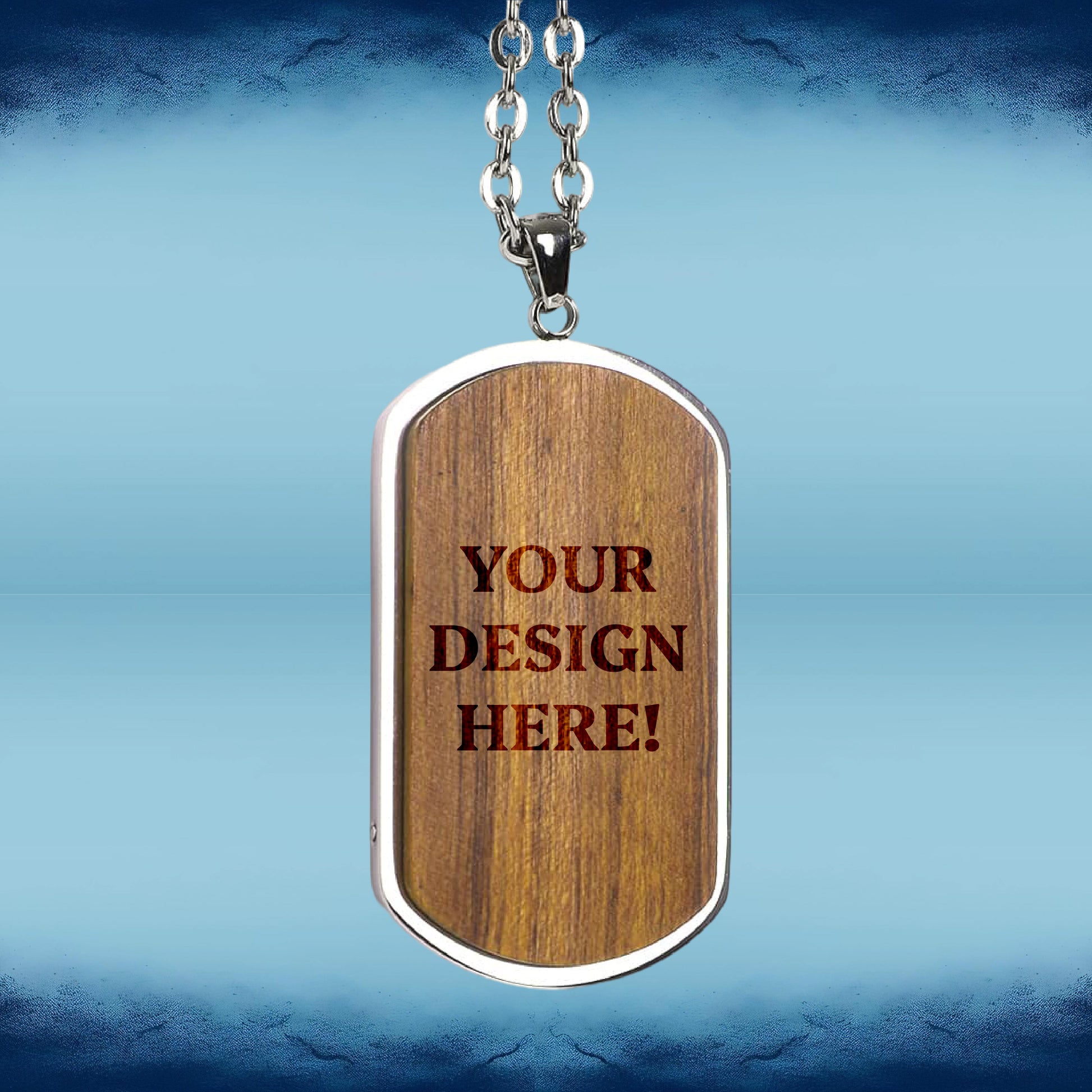 A dog tag pendant necklace with a wood-grain finish and a silver-tone metal border, hanging from a silver chain. The pendant features placeholder text that reads 'YOUR DESIGN HERE!'.