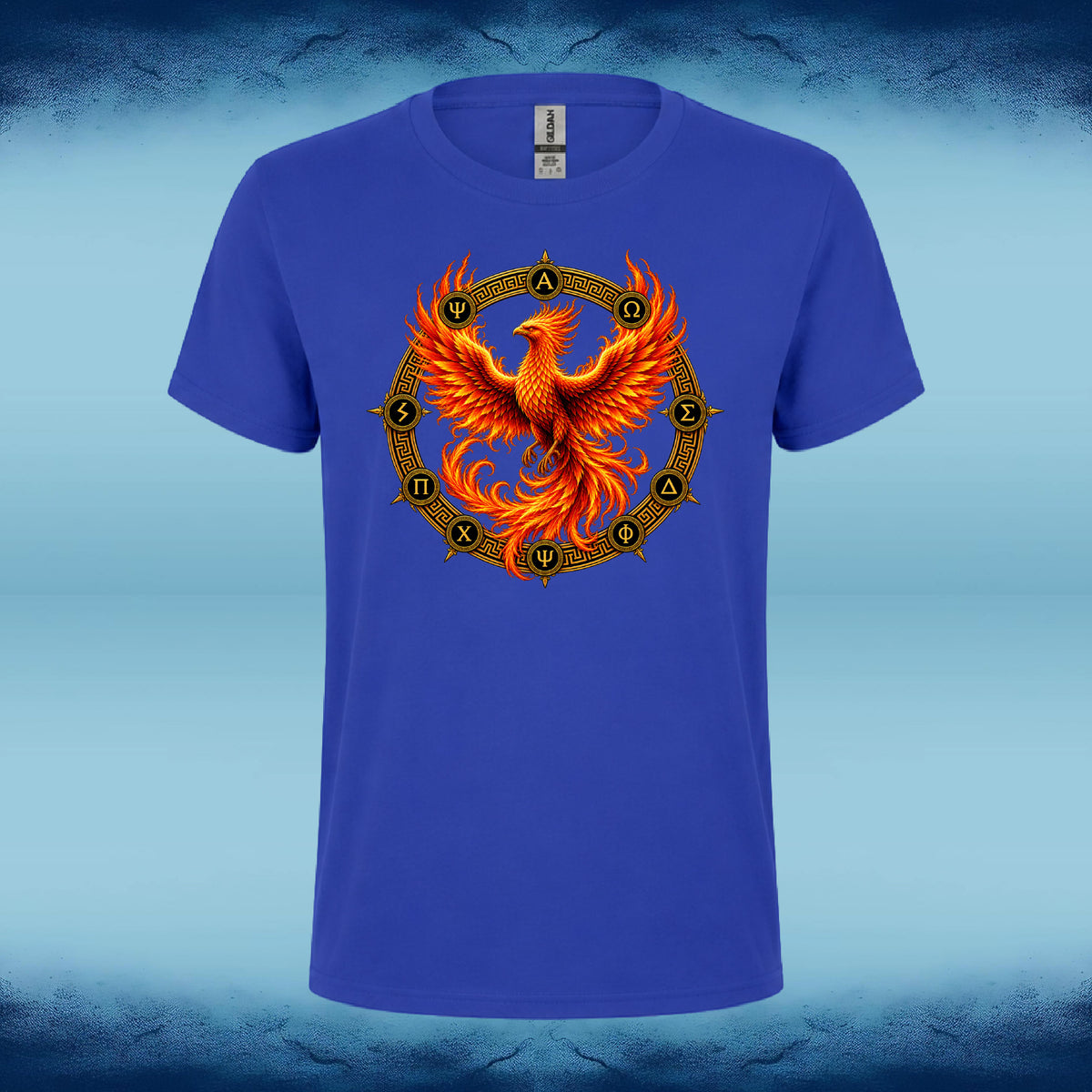 A royal blue short-sleeve t-shirt featuring a large graphic of a fiery orange and yellow phoenix rising from a circular golden chakra-style mandala on the chest, set against a blue textured background.
