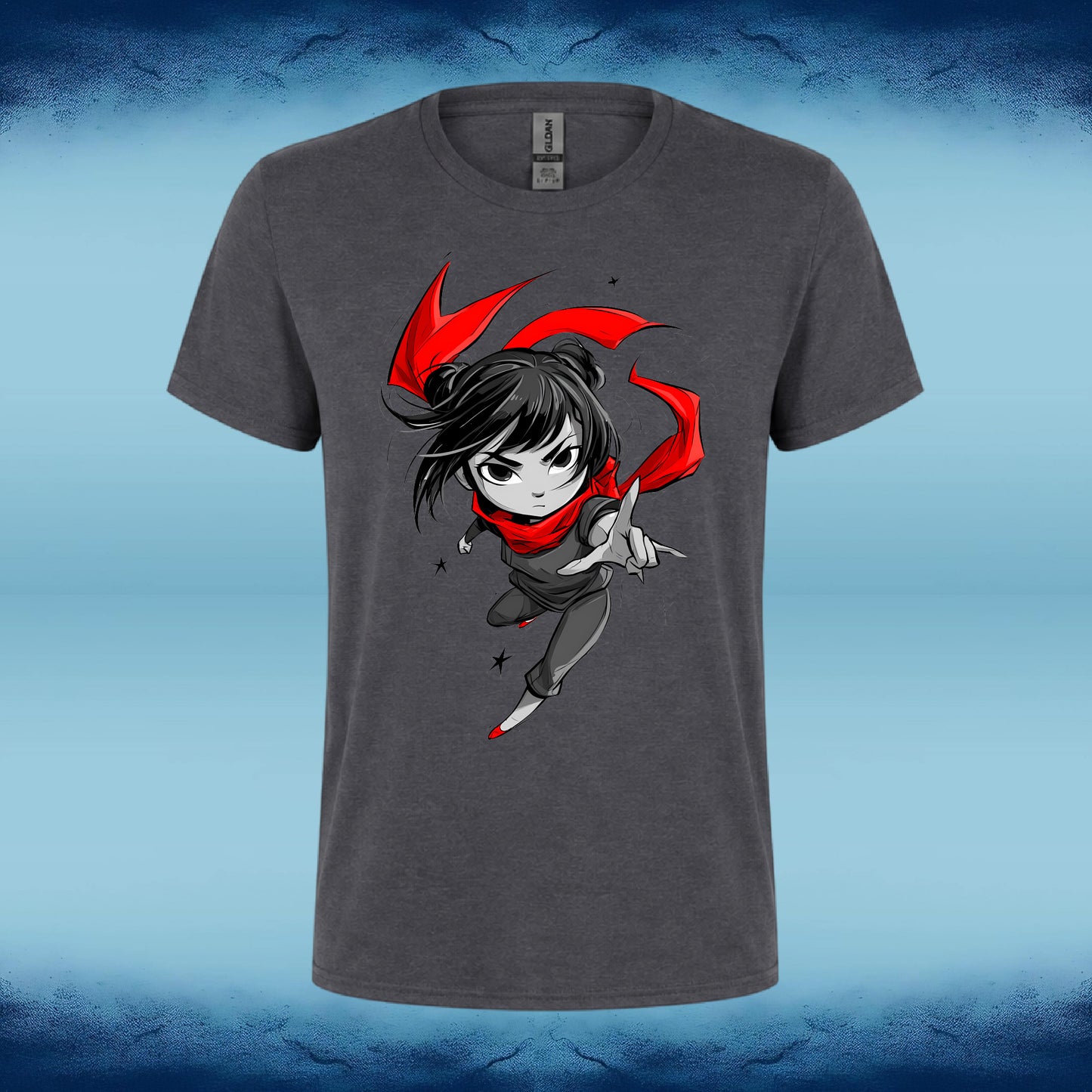 A dark gray heather crewneck t-shirt featuring a cartoon graphic of a chibi-style ninja girl with black hair, a red scarf, and a red cape, shown against a blue gradient background.
