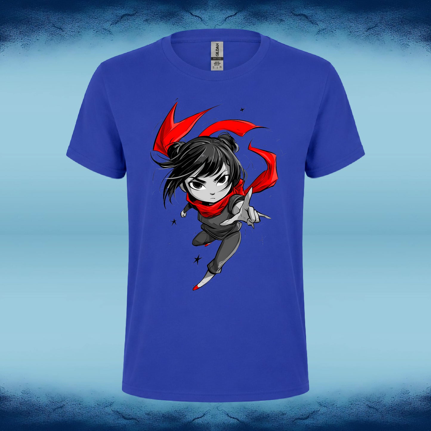 A royal blue short-sleeve t-shirt featuring a cartoon graphic of a female ninja character with black hair, a red scarf, and a gray outfit, set against a light blue textured background.