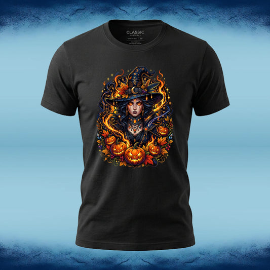 A black short-sleeve t-shirt with a detailed graphic of a witch surrounded by pumpkins and flames, displayed on a blue textured background.
