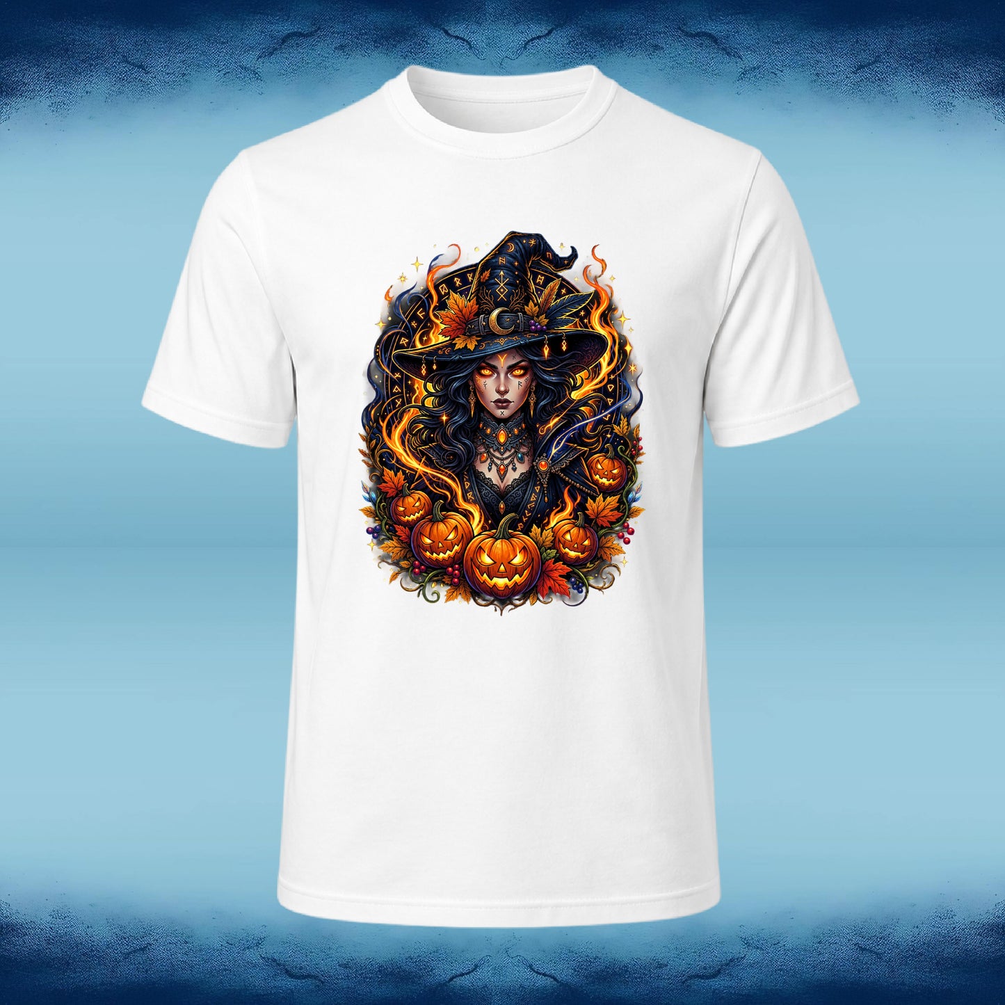 A white short-sleeve crewneck t-shirt featuring a large, detailed graphic print of a witch surrounded by jack-o'-lanterns and autumn leaves, displayed against a blue gradient background.