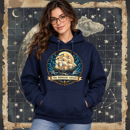 A model wearing The Midnight Voyage pullover hoodie by Sigil Harbor, featuring a nautical fantasy graphic on the chest.