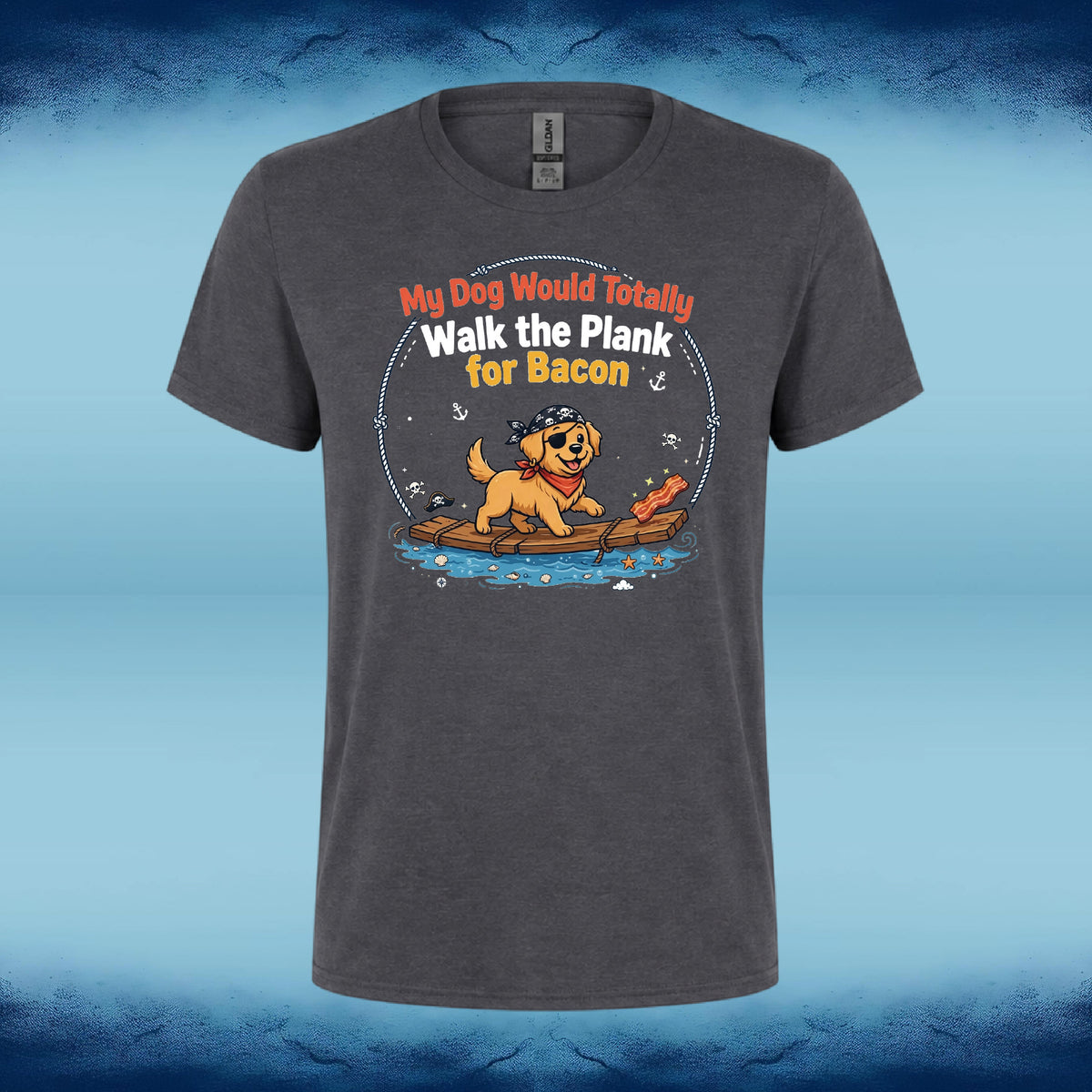 A dark gray heather t-shirt with a cartoon graphic of a golden retriever dog on a raft wearing a pirate hat and bandana, with the text 'My Dog Would Totally Walk the Plank for Bacon'. The shirt is displayed against a blue gradient background.